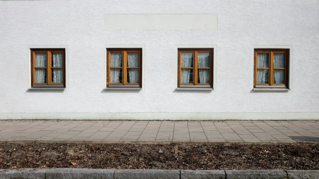 brown window in a frame house